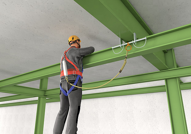 Eine Person trägt bei Bauarbeiten eine Persönliche Schutzausrüstung gegen Absturz (PSAgA).