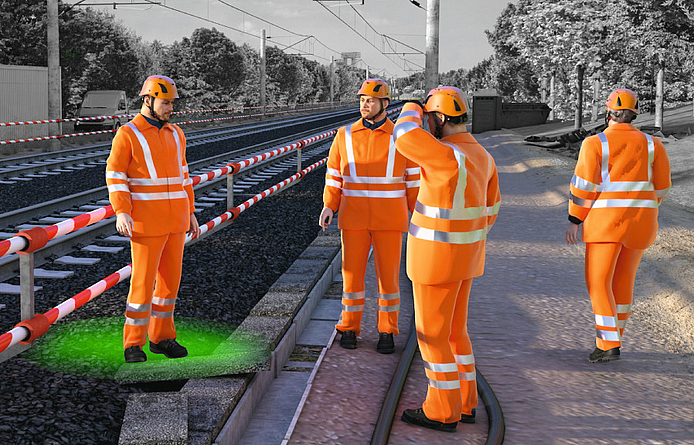 Bauarbeiter arbeiten am Gleis unter wirksamen Sicherungsmaßnahmen. 