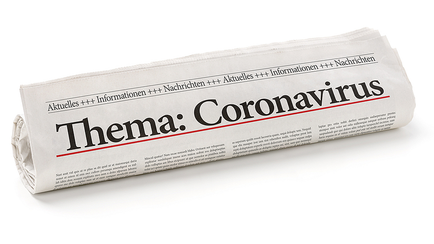 Eine Zeitung mit der Hauptüberschrift: Thema Coronavirus